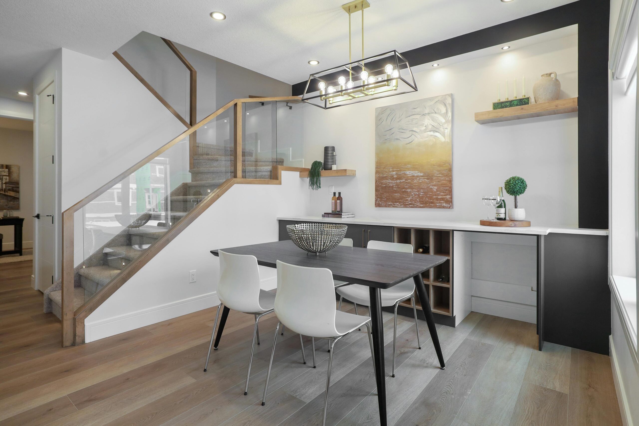 Stylish modern dining area with elegant decor and natural light in an Edmonton apartment.